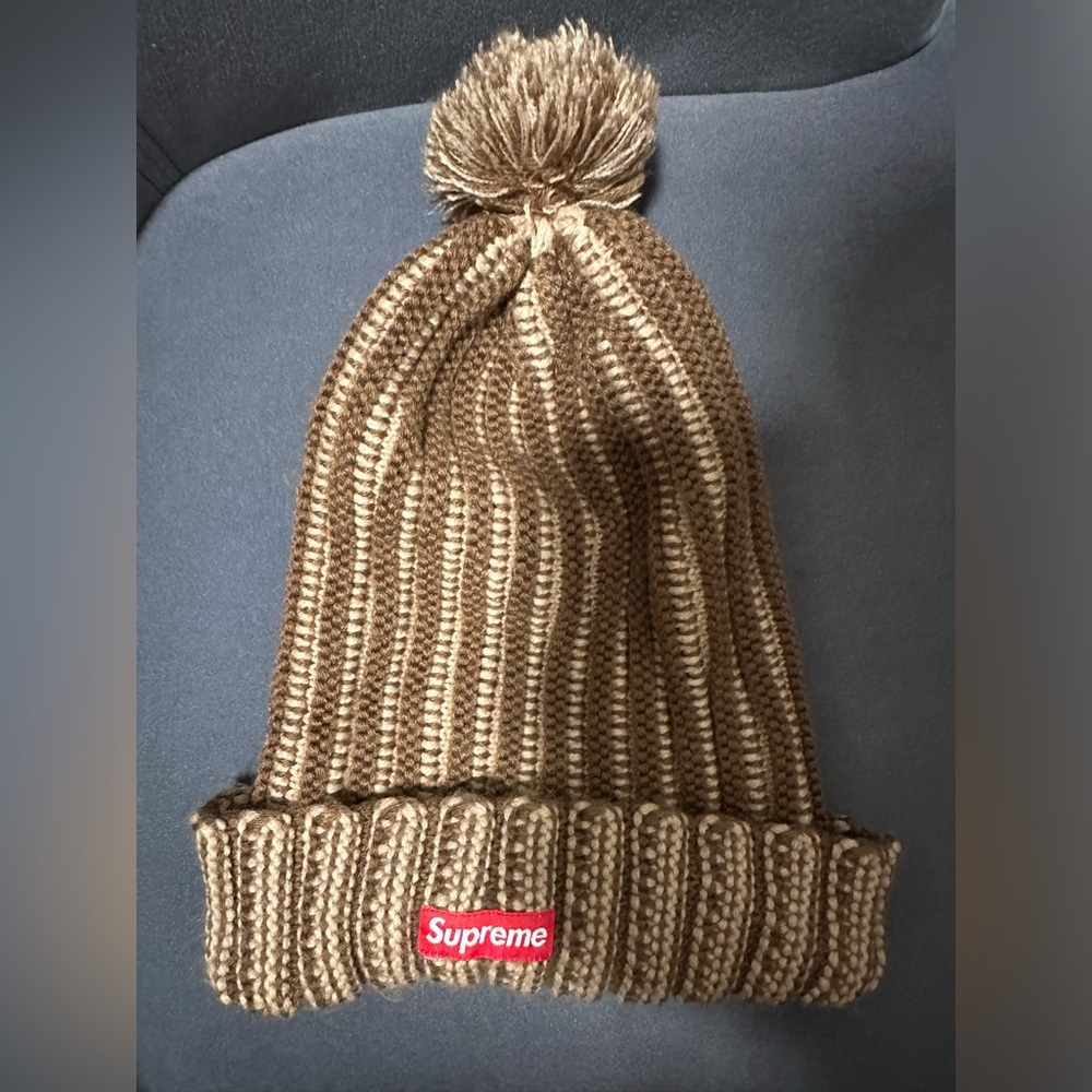 Brown/Tan Pom striped Supreme winter hat.